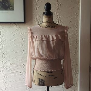 Love Fire peach blouse with ruffle detail and gold horizontal threads